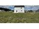 House exterior view, showcasing a white two-story home at 80 Lotus Ave, Smithfield, NC 27577