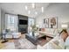 Spacious living room with a fireplace, large windows, and hardwood floors at 170 Aberdeen, Rocky Mount, NC 27804