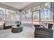 Relaxing screened porch with wicker furniture and a view of nature at 170 Aberdeen, Rocky Mount, NC 27804