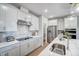 Modern kitchen with white cabinets, quartz countertops and a large island at 170 Aberdeen, Rocky Mount, NC 27804
