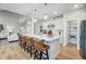 Open concept kitchen with white cabinets, island seating, and stainless steel appliances at 170 Aberdeen, Rocky Mount, NC 27804