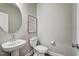 Clean and modern powder room with pedestal sink and toilet at 170 Aberdeen, Rocky Mount, NC 27804