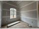 Unfinished bedroom with vaulted ceiling and arched window at 30 Spanish Oak Dr, Youngsville, NC 27596