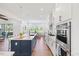 Spacious kitchen with island, stainless steel appliances, and hardwood floors at 8416 Brady Pointe Rd, Fuquay Varina, NC 27526