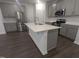 Kitchen island with white quartz countertop and gray cabinets at 10033 Regal Dr # 8, Angier, NC 27501