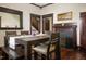 Formal dining room features a dark wood table and a fireplace at 1502 Bahama Rd, Bahama, NC 27503