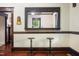 Two vintage-style barstools sit at a kitchen pass-through at 1502 Bahama Rd, Bahama, NC 27503