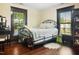 Bedroom with a metal bed frame and hardwood floors at 1502 Bahama Rd, Bahama, NC 27503