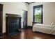 Bedroom with a fireplace and a twin-size bed at 1502 Bahama Rd, Bahama, NC 27503