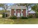 Brick home with a large front porch and mature landscaping at 8428 Nc 39 Highway, Middlesex, NC 27557