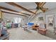 Spacious living room with exposed beams and comfy seating at 8428 Nc 39 Highway, Middlesex, NC 27557