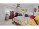 Cozy bedroom with a double bed, wooden dresser, and ceiling fan at 8428 Nc 39 Highway, Middlesex, NC 27557