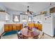 Galley kitchen with wood cabinets and white appliances at 8428 Nc 39 Highway, Middlesex, NC 27557