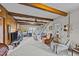 Living room with exposed beams, fireplace and seating area at 8428 Nc 39 Highway, Middlesex, NC 27557