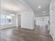 Dining area with wood-look floors, chandelier, and an open floor plan at 1208 Randwick Valley Ct, Zebulon, NC 27597