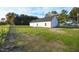 House exterior showcasing a backyard with patchy grass at 400 S Eastwood Dr, Benson, NC 27504