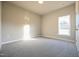 Well-lit bedroom with carpet flooring and a window at 400 S Eastwood Dr, Benson, NC 27504