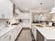 Modern kitchen with white cabinets, stainless steel appliances, and a large island at 464 Cresting Wave Dr # 380, Wake Forest, NC 27587