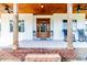Spacious front porch with rocking chairs and brick steps at 997 Jackson Rd, Fuquay Varina, NC 27526