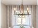Dining area with chandelier and view of backyard at 997 Jackson Rd, Fuquay Varina, NC 27526