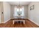 Charming dining area with wood floors and striped wallpaper at 997 Jackson Rd, Fuquay Varina, NC 27526