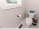 Small bathroom with hexagon tile floor and white toilet at 997 Jackson Rd, Fuquay Varina, NC 27526