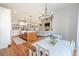 Bright kitchen with island, hardwood floors, and dining area at 997 Jackson Rd, Fuquay Varina, NC 27526