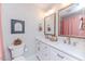 Double vanity bathroom with marble floor and pink accents at 997 Jackson Rd, Fuquay Varina, NC 27526