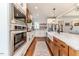 Modern kitchen with stainless steel appliances and white shaker cabinets at 997 Jackson Rd, Fuquay Varina, NC 27526