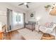 Charming Bedroom with crib, rocking chair, and wood floors at 997 Jackson Rd, Fuquay Varina, NC 27526