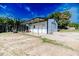 White metal garage with covered patio and dog kennel at 997 Jackson Rd, Fuquay Varina, NC 27526