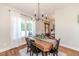 Elegant dining room featuring a farmhouse table and chandelier at 997 Jackson Rd, Fuquay Varina, NC 27526