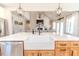 Farmhouse sink with a modern black gooseneck faucet in a white kitchen at 997 Jackson Rd, Fuquay Varina, NC 27526