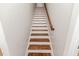 Elegant staircase with dark wood treads and white risers at 997 Jackson Rd, Fuquay Varina, NC 27526