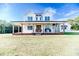 Two story farmhouse with large front porch and expansive lawn at 997 Jackson Rd, Fuquay Varina, NC 27526