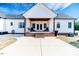 White farmhouse exterior with covered porch and brick steps at 997 Jackson Rd, Fuquay Varina, NC 27526