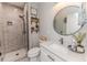 Modern bathroom with gray tile shower and white vanity at 997 Jackson Rd, Fuquay Varina, NC 27526