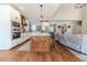 Modern kitchen features white cabinets, a wooden range hood, and patterned backsplash at 997 Jackson Rd, Fuquay Varina, NC 27526