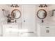 Double vanity bathroom with hexagon tile floor and modern fixtures at 997 Jackson Rd, Fuquay Varina, NC 27526