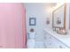 Bathroom with a pink shower curtain, double vanity, and marble floor at 997 Jackson Rd, Fuquay Varina, NC 27526