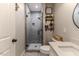 Updated bathroom with gray tile shower and white vanity at 997 Jackson Rd, Fuquay Varina, NC 27526