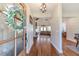 Inviting entryway with hardwood floors and views into the living room at 997 Jackson Rd, Fuquay Varina, NC 27526