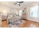 Bright bedroom with hardwood floors and ceiling fan at 997 Jackson Rd, Fuquay Varina, NC 27526