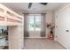 Cozy bedroom with a loft bed, guitar, and large window at 997 Jackson Rd, Fuquay Varina, NC 27526