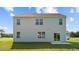 Rear view of a two-story house with a patio and grassy backyard at 7600 Michelle Rd, Rocky Mount, NC 27803