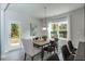 Bright dining area with wood table and access to backyard at 591 Glenkirk Pl # 106, Garner, NC 27529