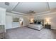 Spacious main bedroom with plush carpeting and large windows at 591 Glenkirk Pl # 106, Garner, NC 27529
