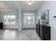 Front entry with hardwood floors and a view to the living room and front yard at 591 Glenkirk Pl # 106, Garner, NC 27529