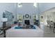 Spacious living room with comfortable seating and a fireplace at 591 Glenkirk Pl # 106, Garner, NC 27529