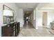 Bright and spacious entryway with hardwood floors and a view to the living room at 591 Glenkirk Pl # 106, Garner, NC 27529